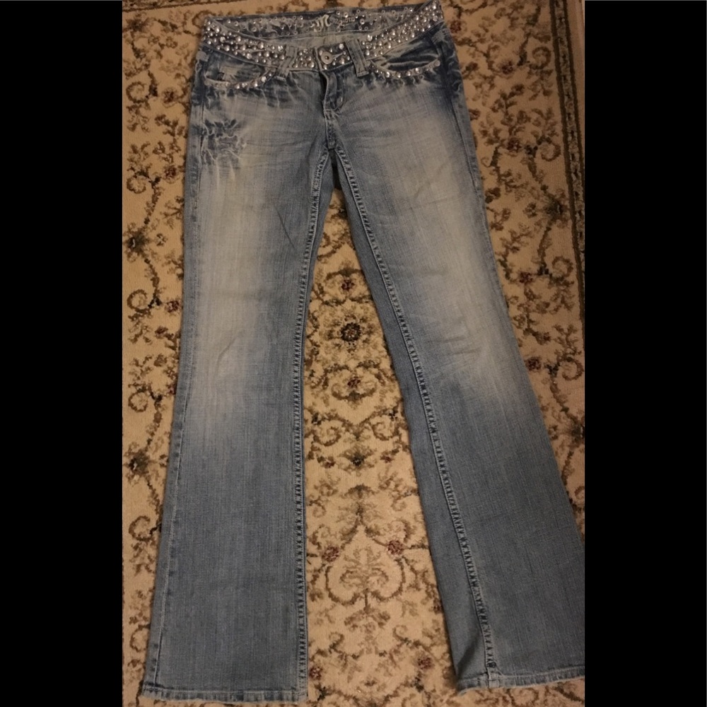 Miss Me Jeans with rhinestone and stud detail.